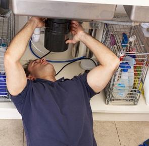 Jack, one of our Orinda plumbers is repairing a broken garbage disposal 